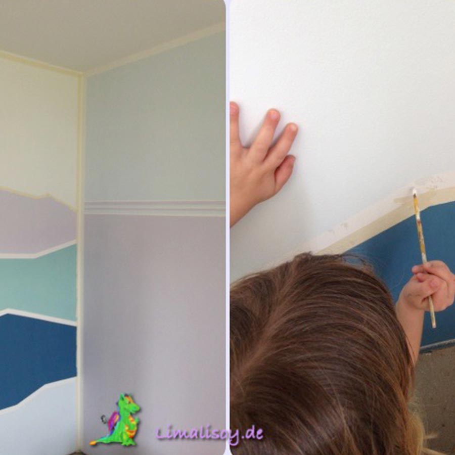 Ein Kind bemalt eine Wand mit geometrischen Linien.