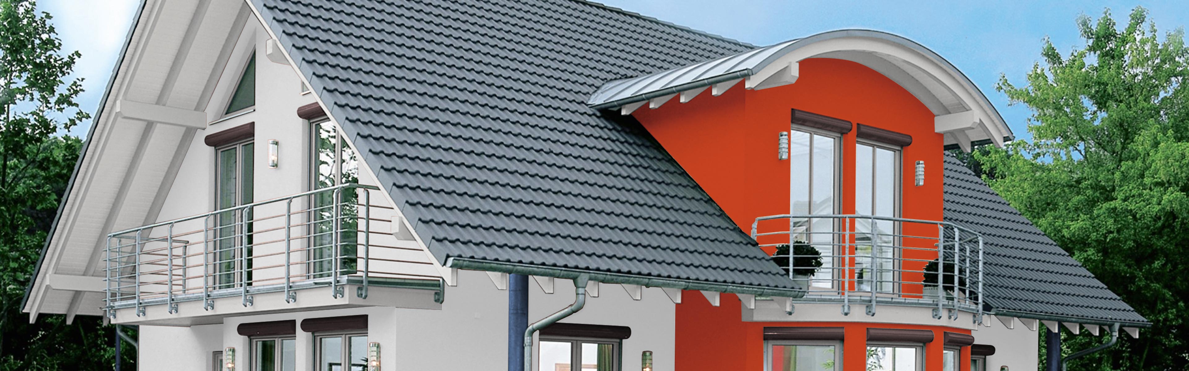 Ein Einfamilienhaus mit Satteldach und einer roten Fassade